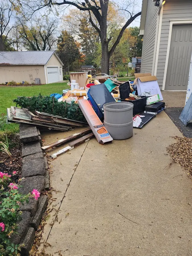 Dumpster being loaded with debris for Roofing Dumpster Rental in San Marcos